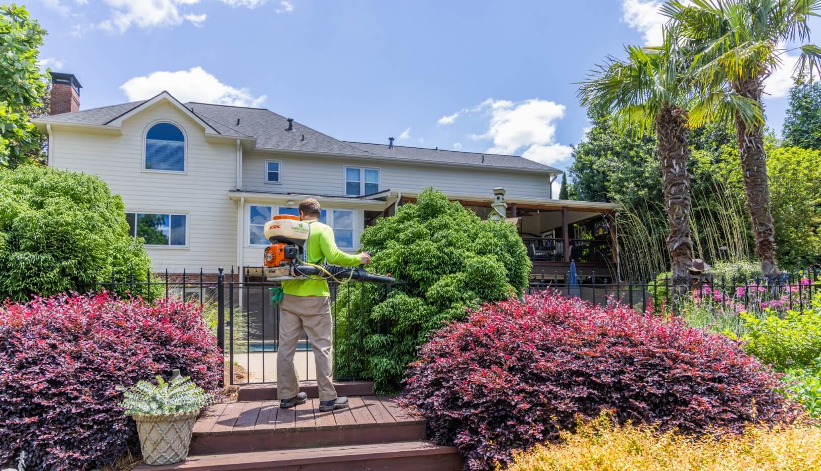 Simply Green Lawn Care Technician using a mosquito fogger